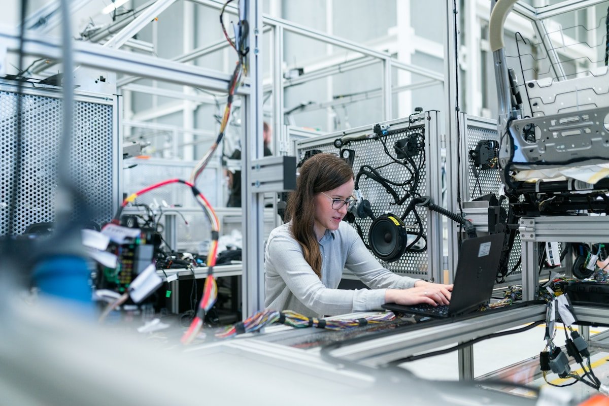 Engineers reviewing electronic product compliance documentation in a professional lab